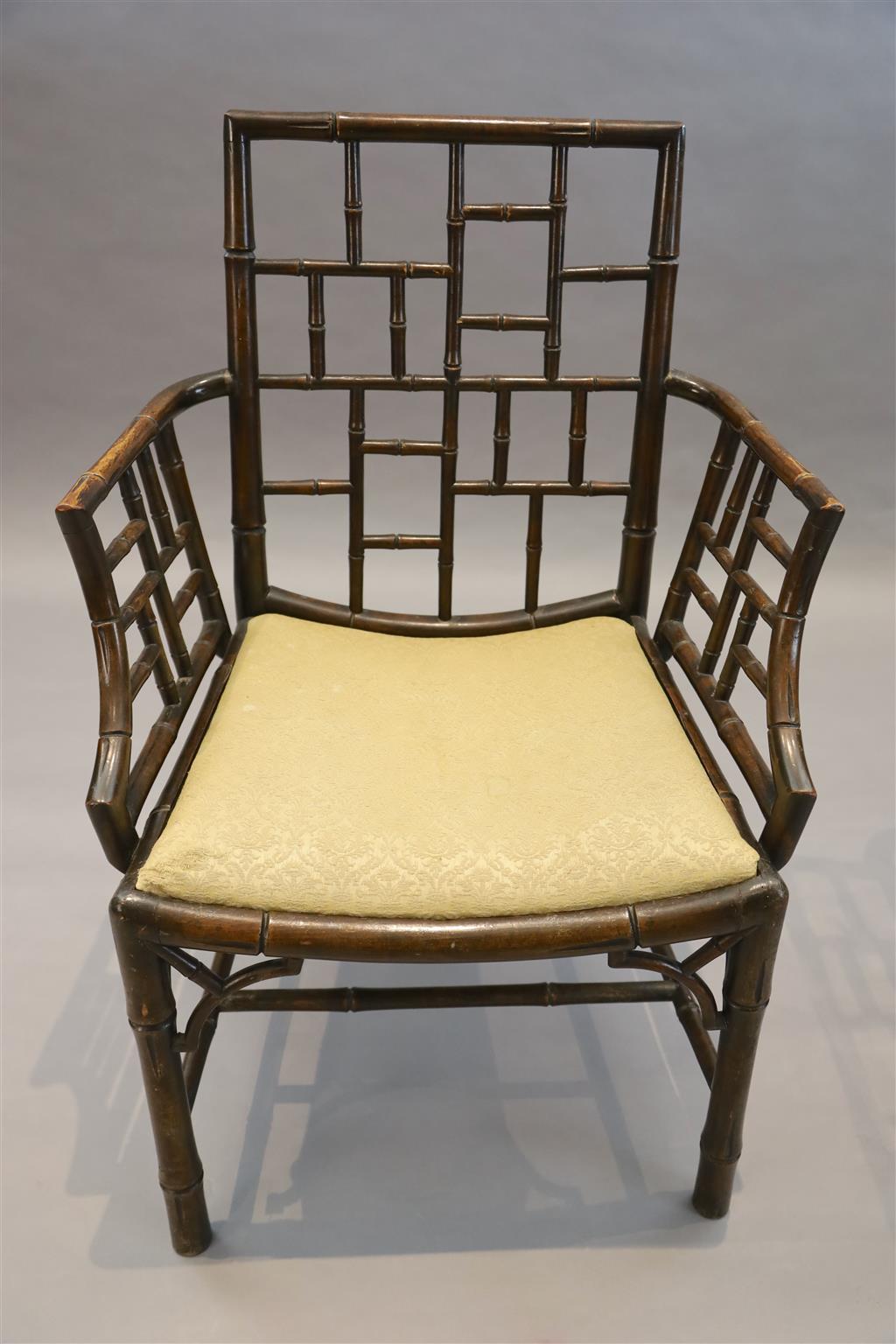 A set of four George III stained mahogany and beech simulated bamboo cockpen elbow chairs, W.2ft 2in. D.1ft 8in. H.3ft 1.5in.